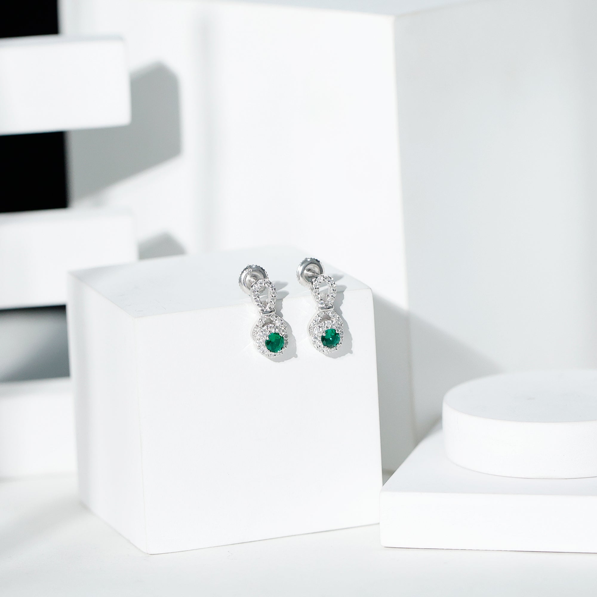 Half Carat Lab Grown Emerald Infinity Stud Earrings with Moissanite