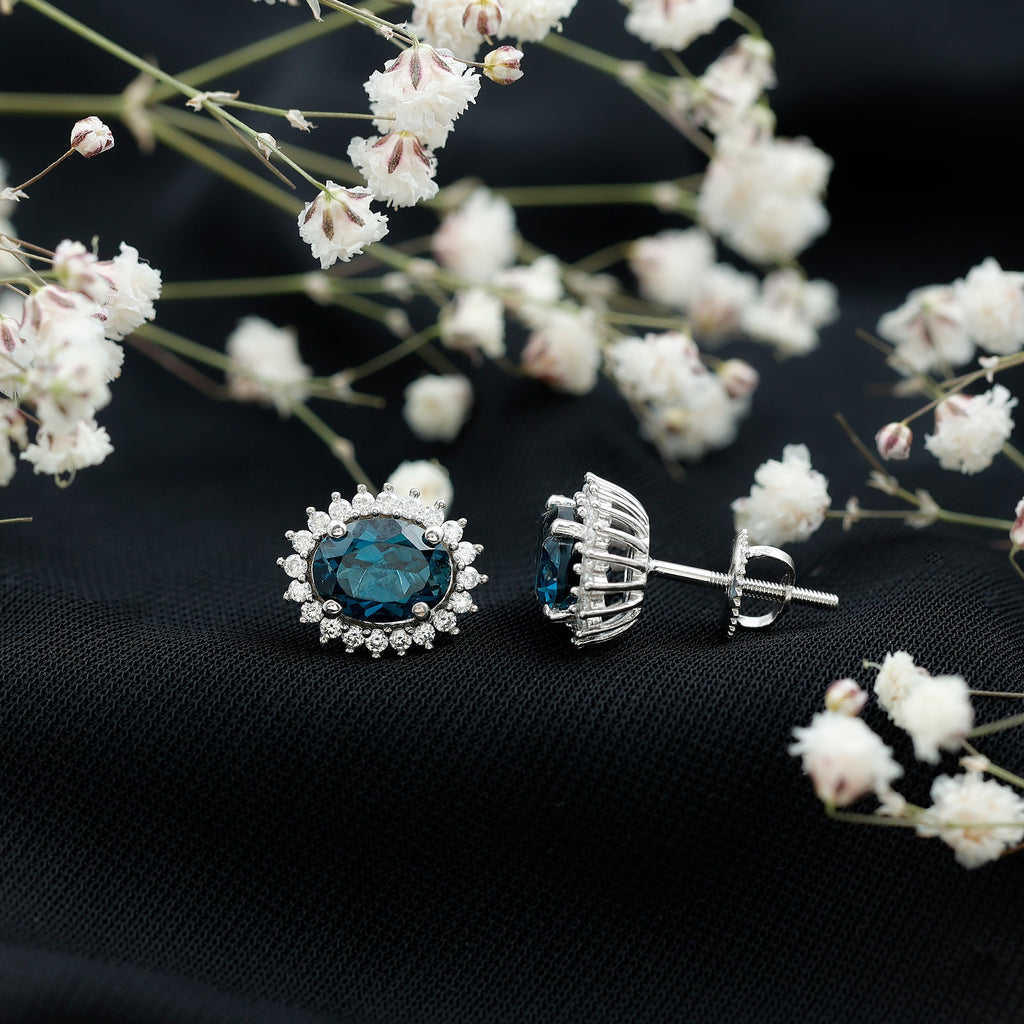 6X8MM Oval London Blue Topaz Stud Earrings with Moissanite Halo