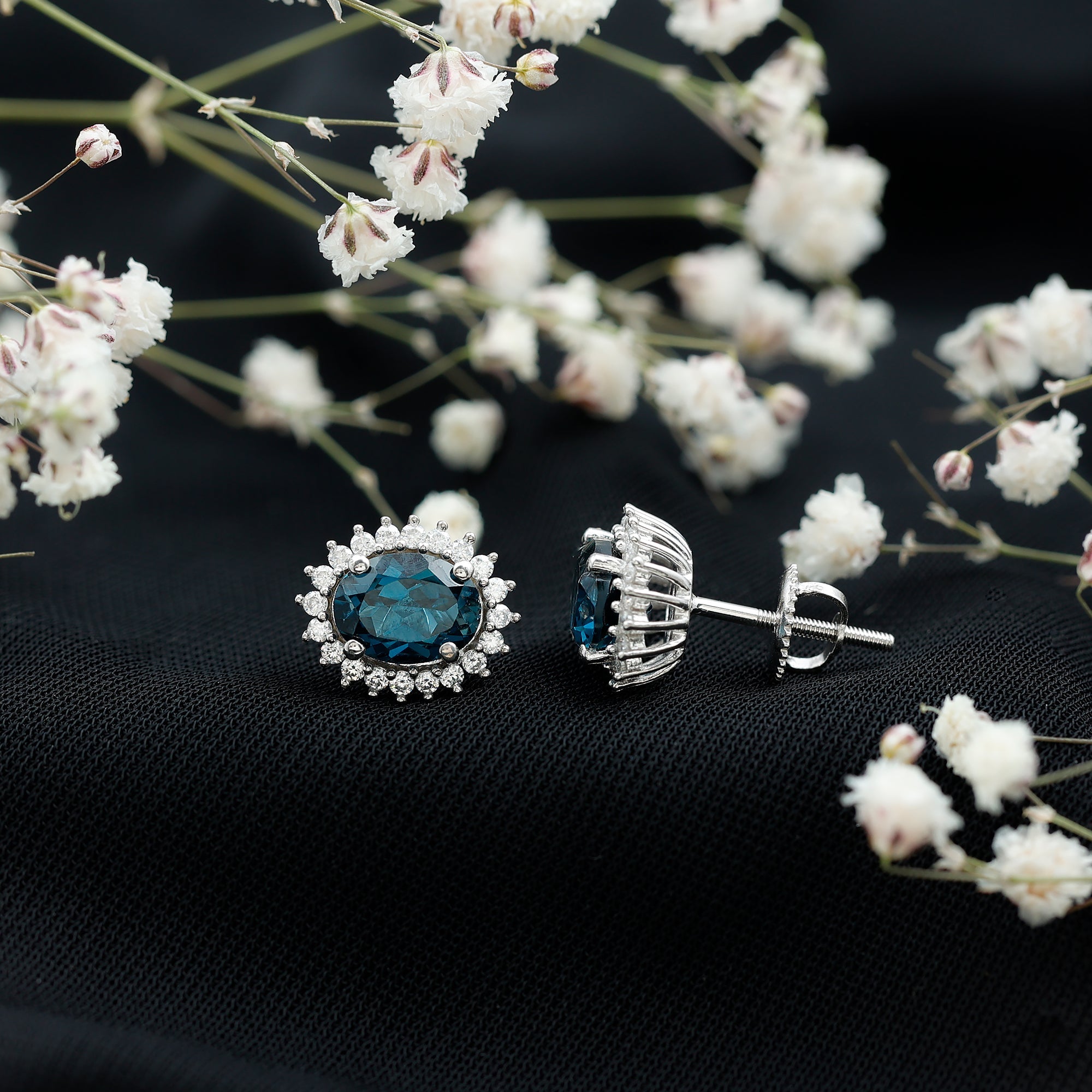 Oval Shaped 2.2 Carat London Blue Topaz Stud Earrings with Moissanite Halo