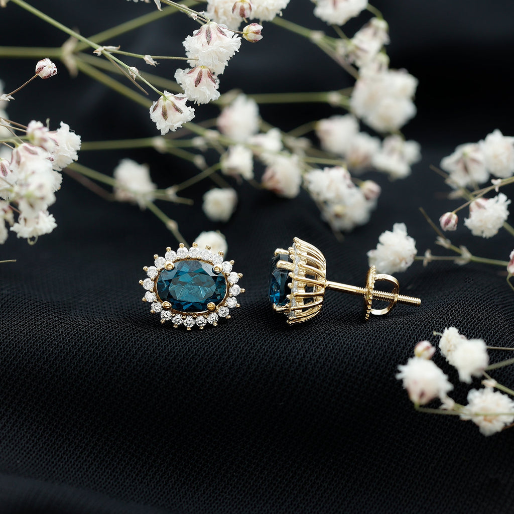 6X8MM Oval London Blue Topaz Stud Earrings with Moissanite Halo