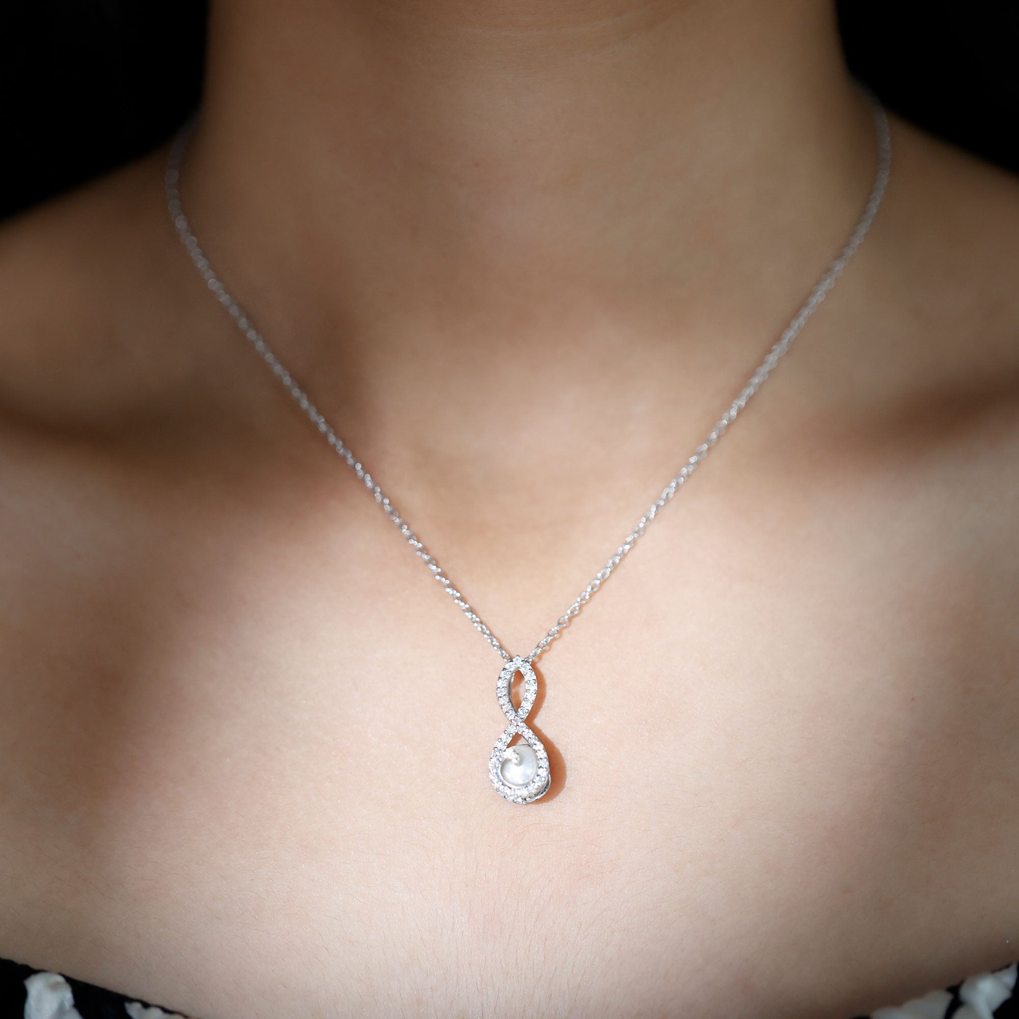 Freshwater White Pearl and Moissanite Infinity Pendant in Silver