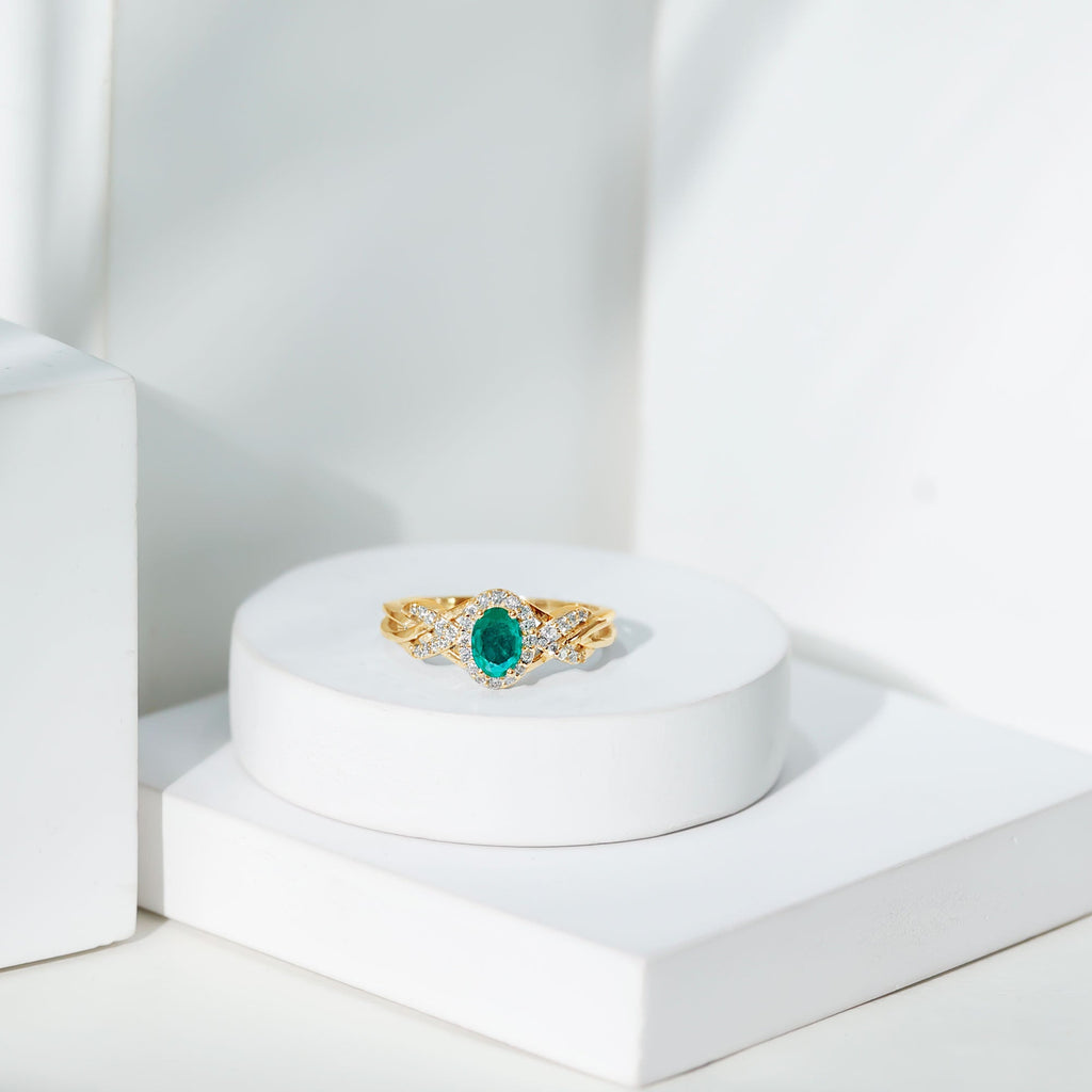 Designer Emerald Oval Engagement Ring with Diamond Halo