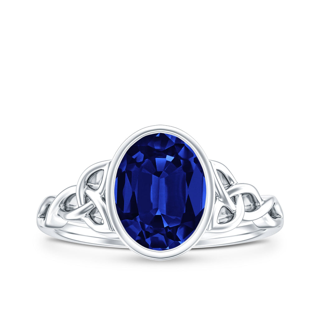 Certified 4 Carat Oval Lab Grown Blue Sapphire Bezel Set Engagement Ring