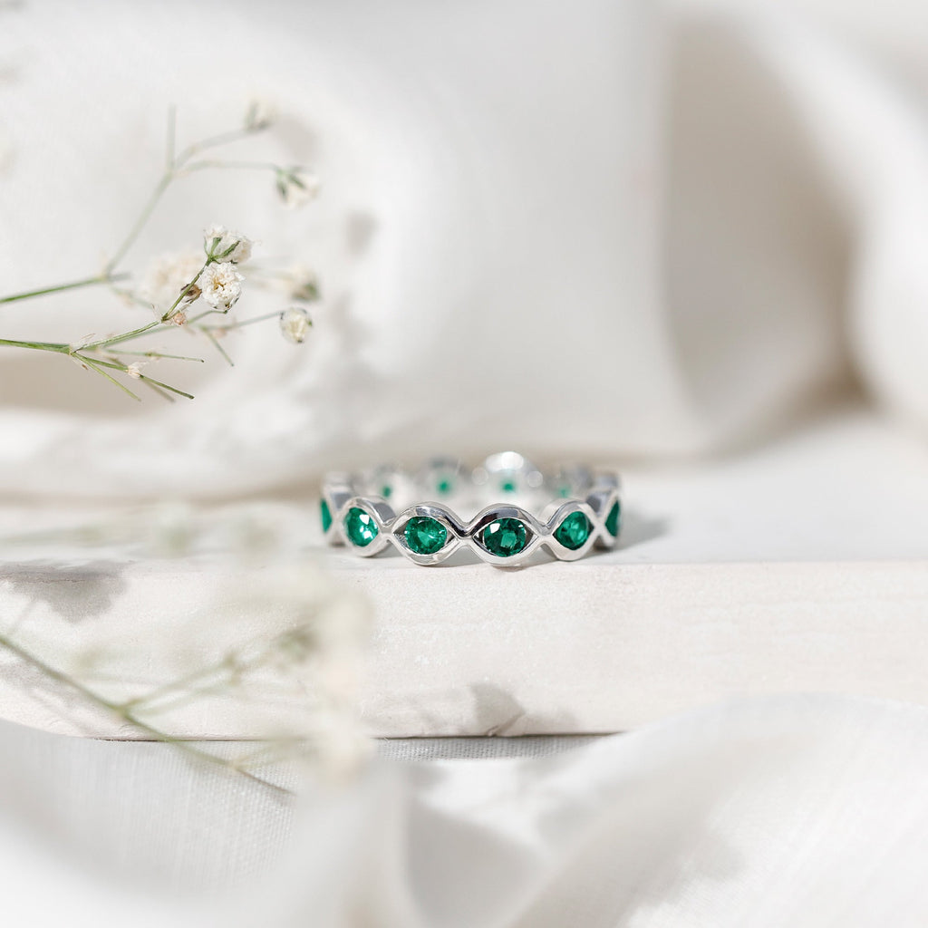Certified Lab Grown Emerald Infinity Twisted Eternity Ring