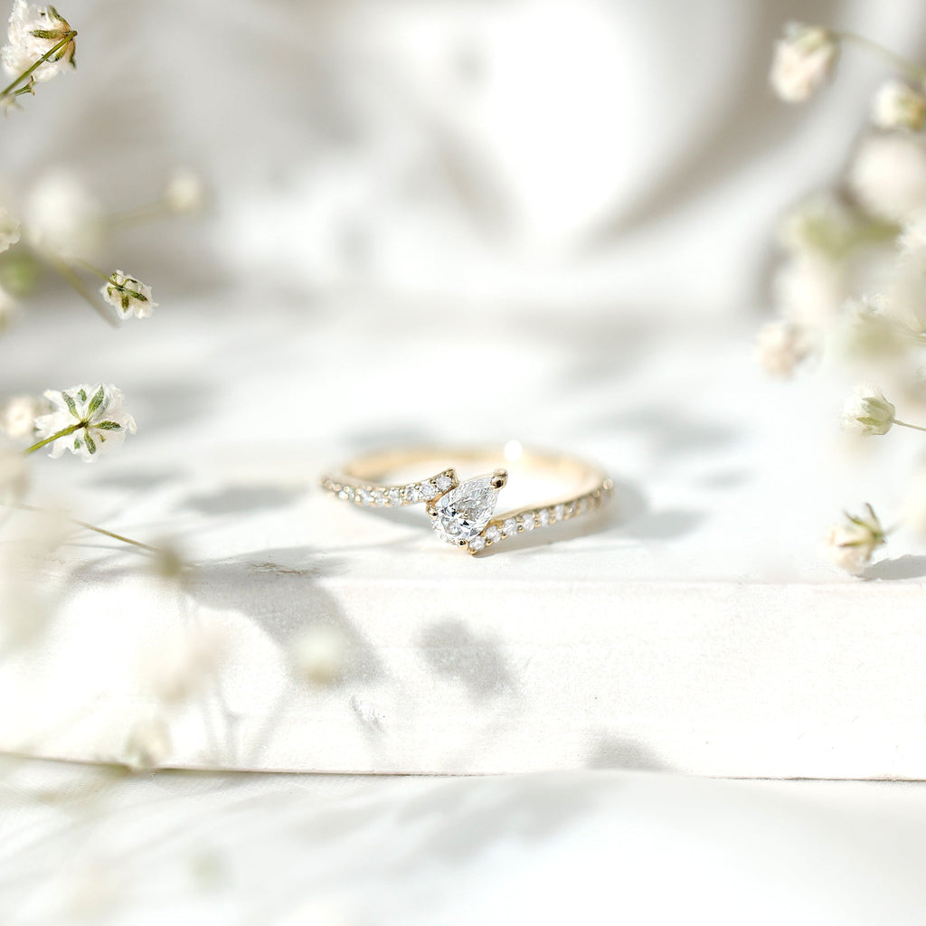 Tilted Pear Shape Simulated Diamond Bypass Promise Ring