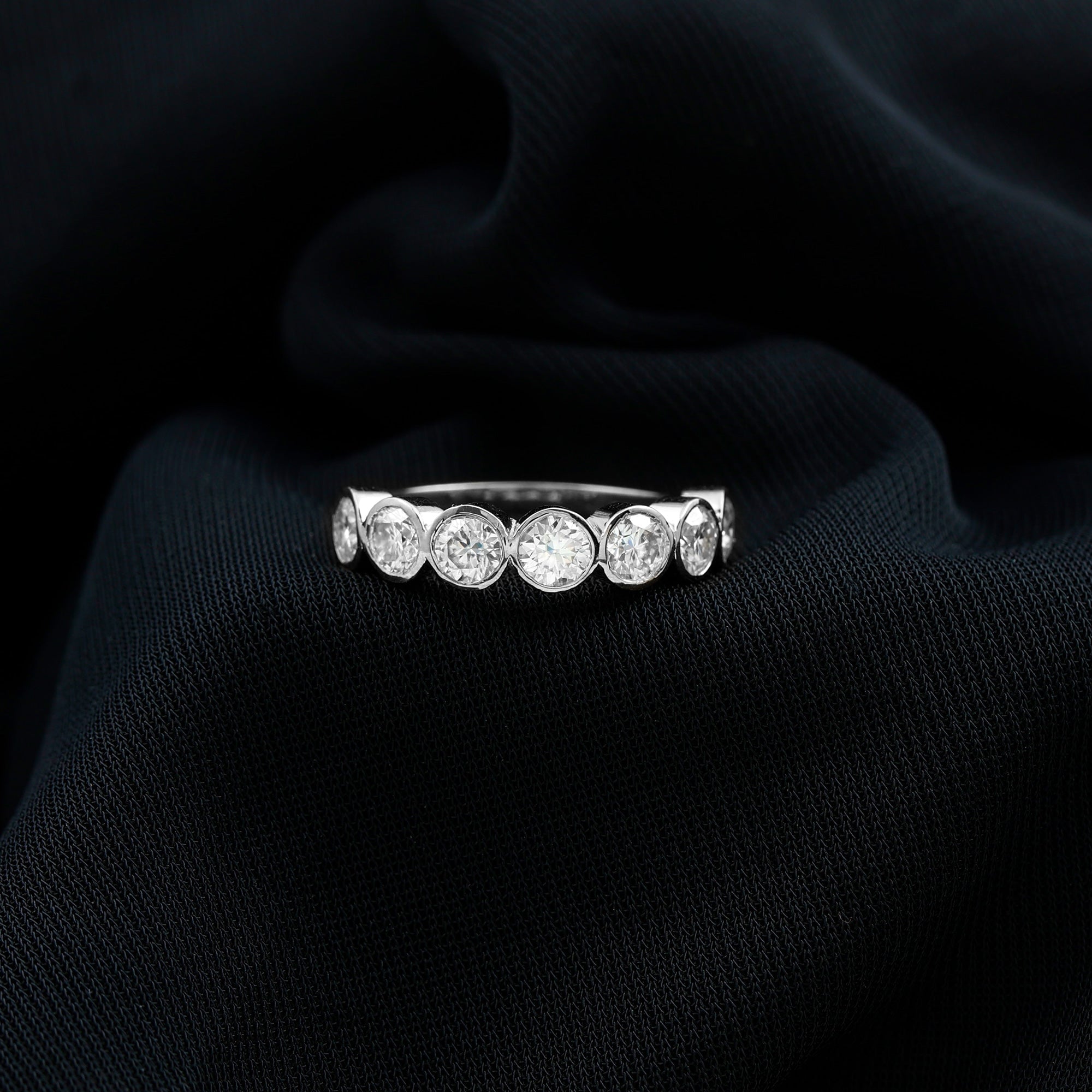 2.2 Carat Round Moissanite Half Eternity Ring in Bezel Setting