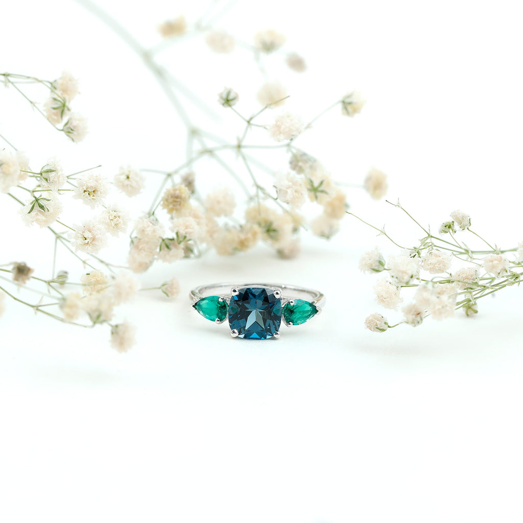 2.8 Carat Cushion Shape London Blue Topaz Three Stone Engagement Ring with Lab Emerald