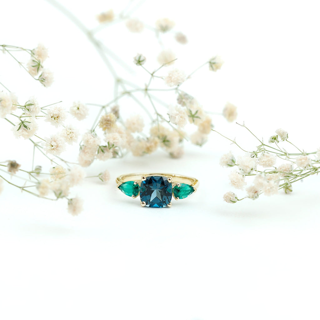 2.8 Carat Cushion Shape London Blue Topaz Three Stone Engagement Ring with Lab Emerald